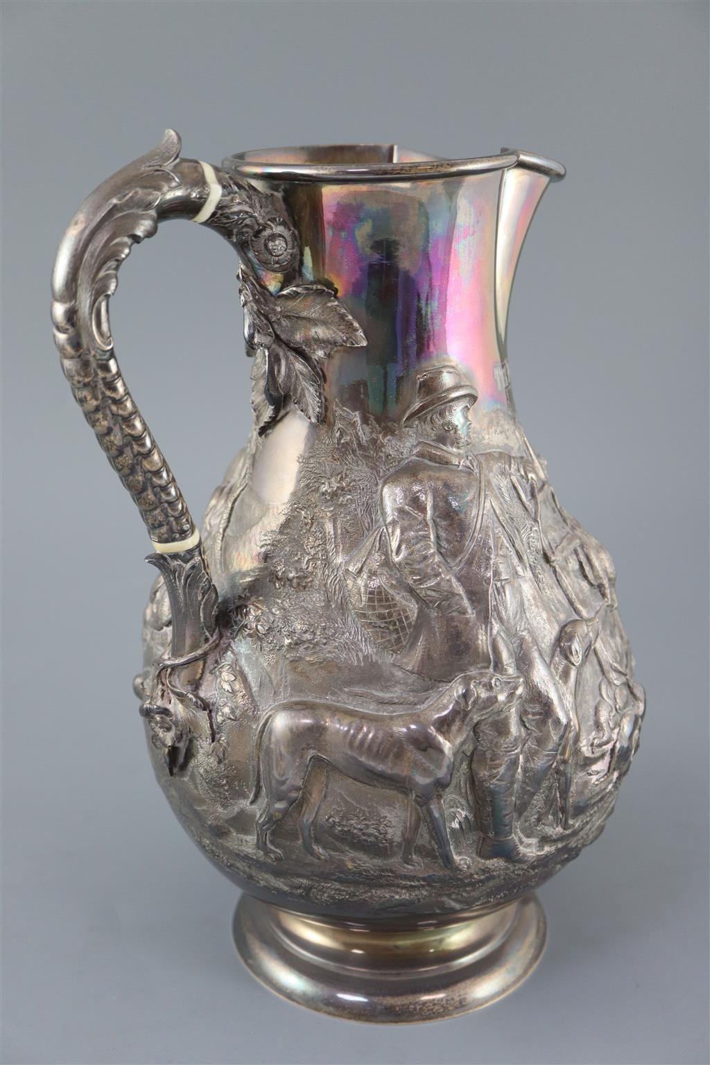 A large Victorian silver baluster hot water jug, by Robert Hennell IV,